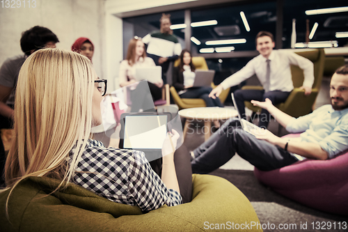 Image of blonde businesswoman using digital tablet