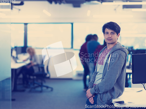 Image of Portrait of smiling male software developer