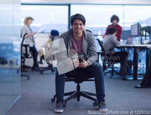 Image of software developer using mobile phone