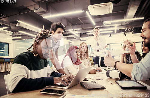 Image of multiethnic business team learning about drone technology