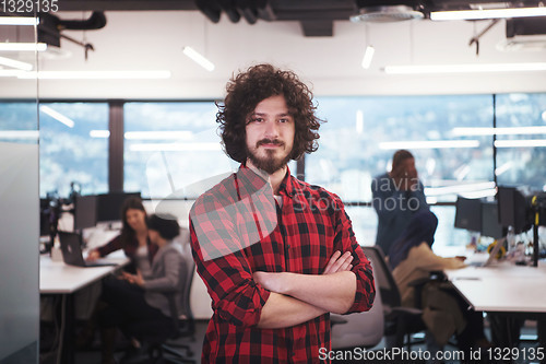 Image of Portrait of smiling male software developer