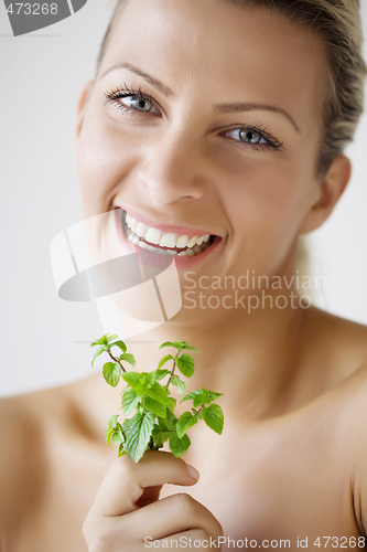 Image of female with fresh herbs