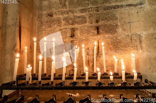 Image of candles in a church in Italy