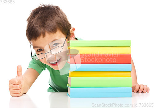 Image of Little boy is reading a book