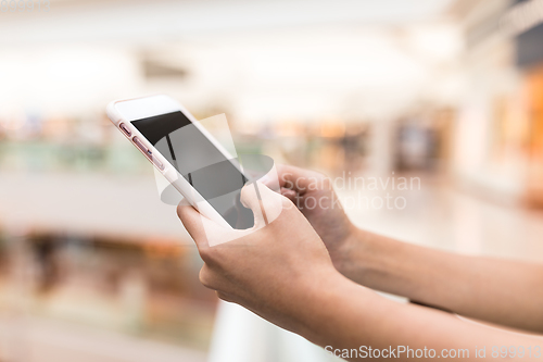 Image of Finger touch on cellphone