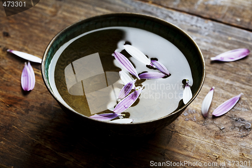 Image of rustic bowl with petals