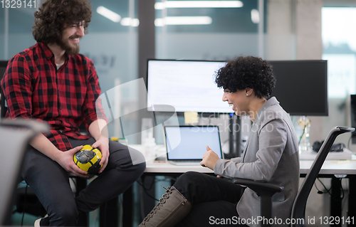 Image of software developers couple writing programming code