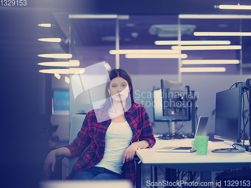 Image of female software developer using laptop computer