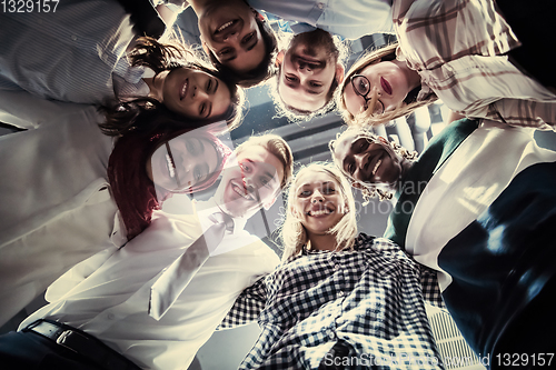 Image of multiethnic Group of young business people celebrating success