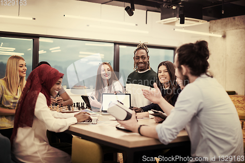 Image of Young Multiethnic Business team using virtual reality headset