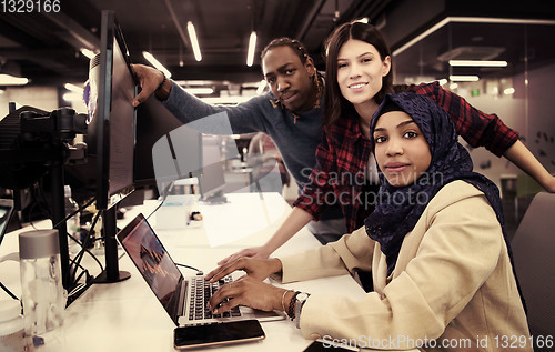 Image of multiethnics team of software developers working together