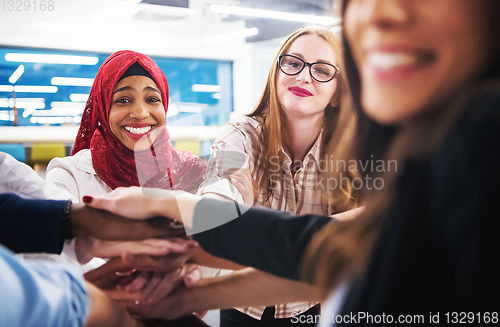 Image of multiethnic Group of young business people celebrating success