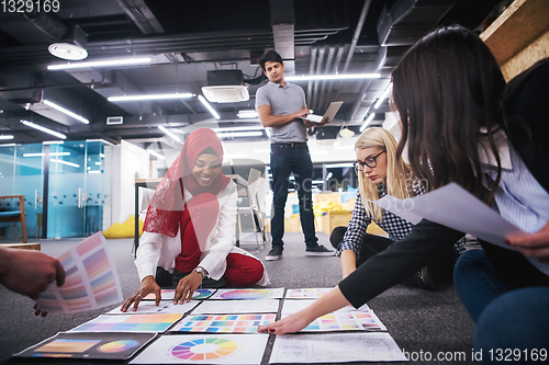 Image of black muslim woman having meeting with Multiethnic  startup busi