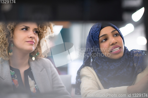 Image of multiethnics team of software developers working together