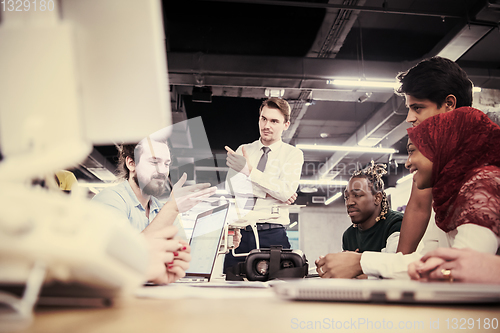 Image of multiethnic business team learning about drone technology