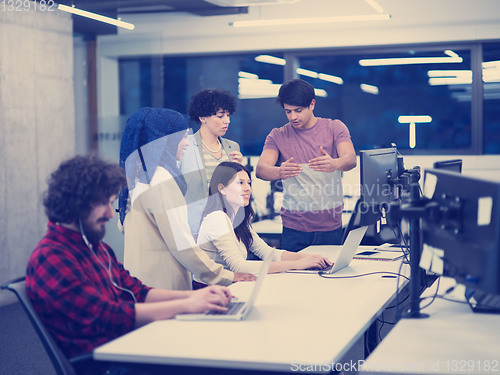 Image of multiethnics team of software developers working together
