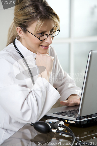 Image of female doctor in her office