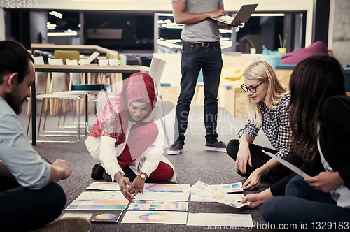 Image of black muslim woman having meeting with Multiethnic  startup busi