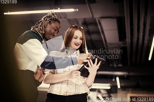 Image of multiethnic business couple using a tablet computer