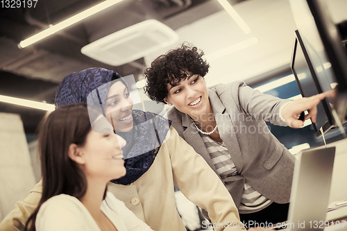 Image of multiethnics team of software developers working together