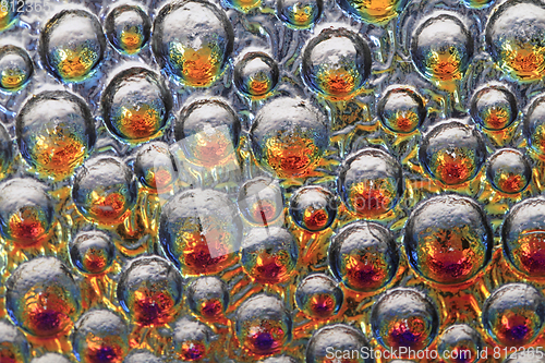 Image of abstract water rainbow drops on the glass