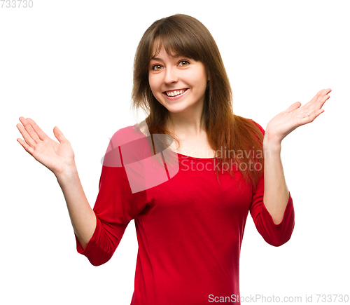 Image of Portrait of a young woman raised her hands up