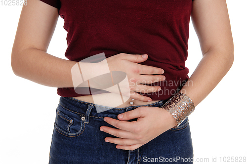 Image of Closeup of a woman's stomach with pain