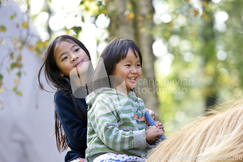 Image of Two girls with horse