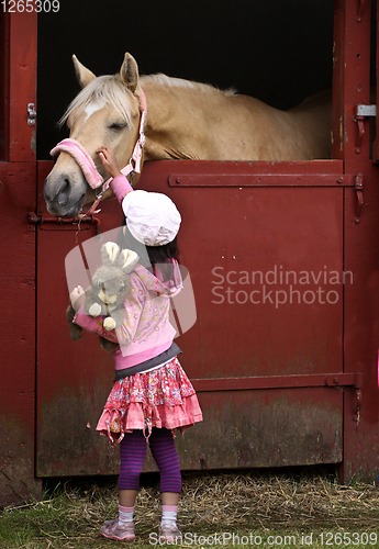 Image of Child with hat with horse