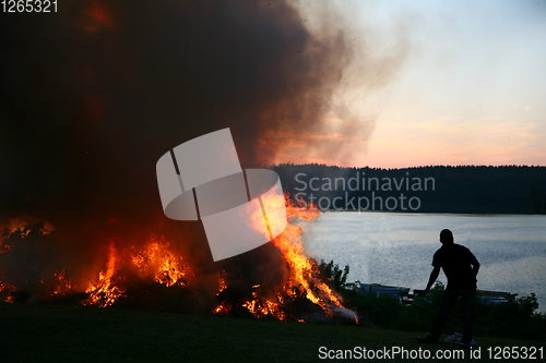 Image of Outdoor fire nearby a lake in the summer in Denmark