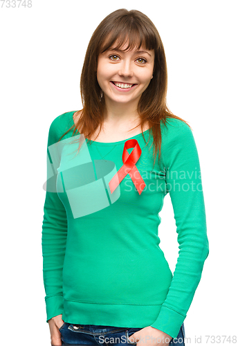 Image of Woman with the red awareness ribbon