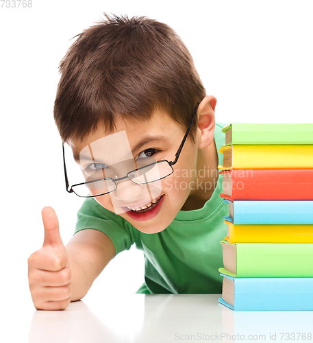 Image of Little boy is reading a book
