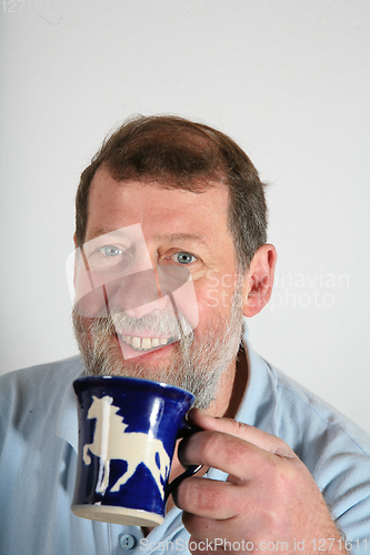 Image of Mature scandinavian man driking coffee