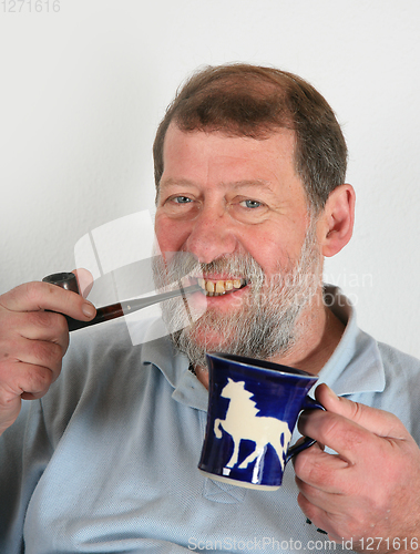 Image of Mature scandinavian man driking coffee