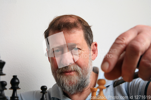 Image of Mature scandinavian man playing chess