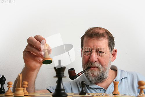 Image of Mature scandinavian man playing chess