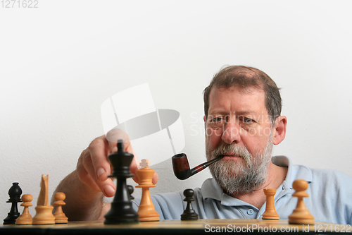 Image of Mature scandinavian man playing chess