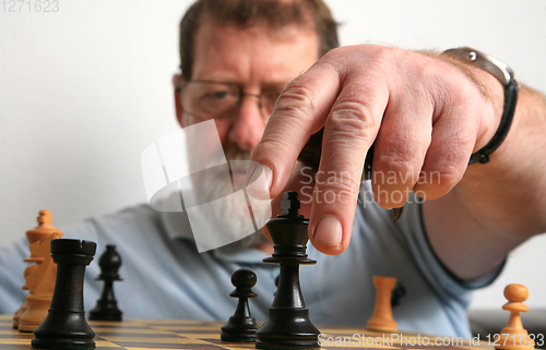 Image of Mature scandinavian man playing chess