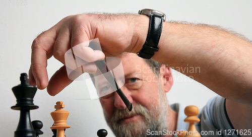 Image of Mature scandinavian man playing chess