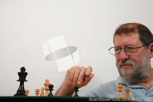 Image of Mature scandinavian man playing chess