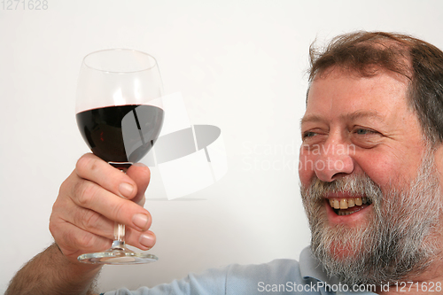 Image of Mature scandinavian man drinking red vine
