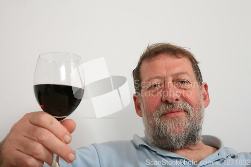 Image of Mature scandinavian man drinking red vine