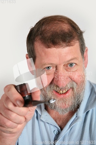 Image of Mature scandinavian man smoking  pipe