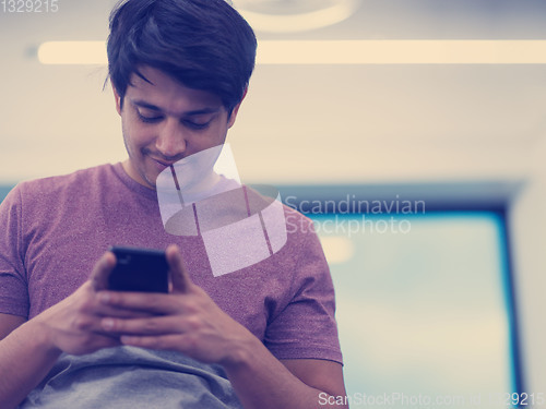Image of software developer using mobile phone