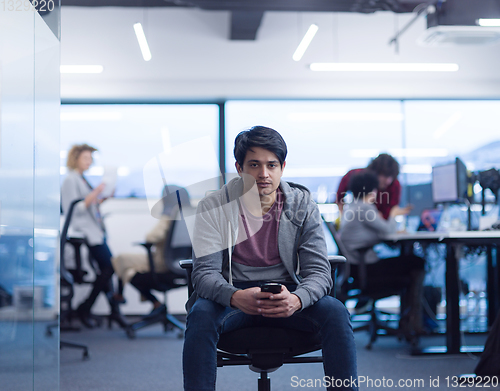 Image of software developer using mobile phone