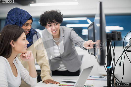 Image of multiethnics team of software developers working together