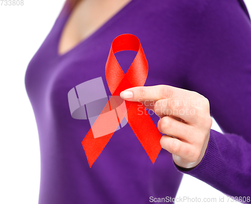 Image of Woman is holding the red awareness ribbon