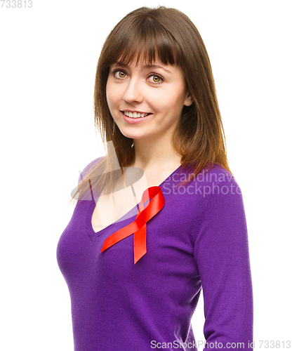 Image of Woman with the red awareness ribbon