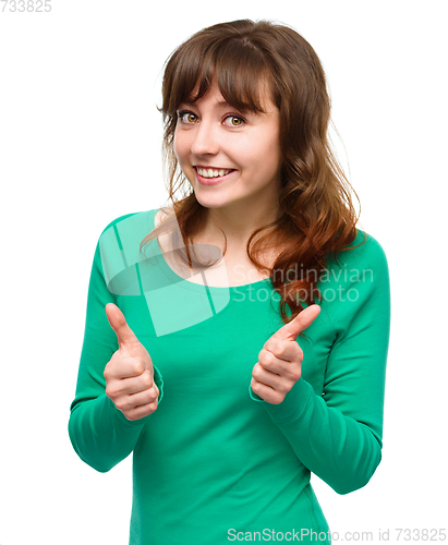 Image of Woman is showing thumb up gesture