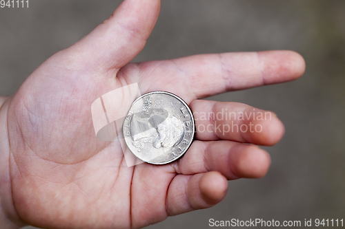 Image of American coin in hand